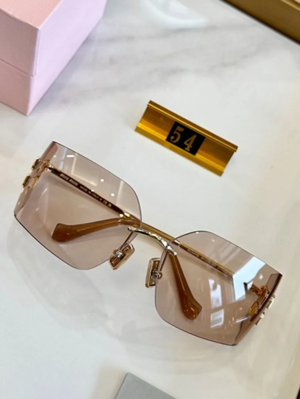 Miu Miu Rimless Square Sunglasses Logo Detail